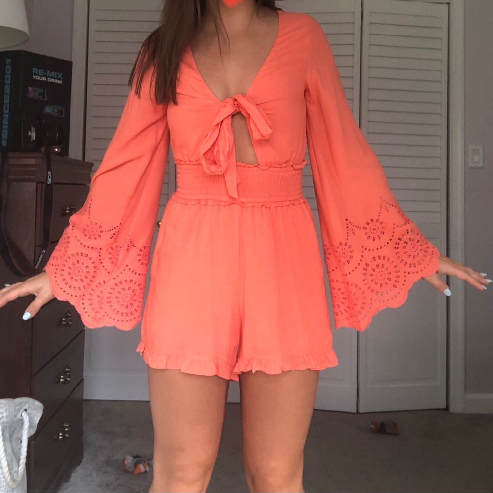Francesca’s coral long-sleeve romper